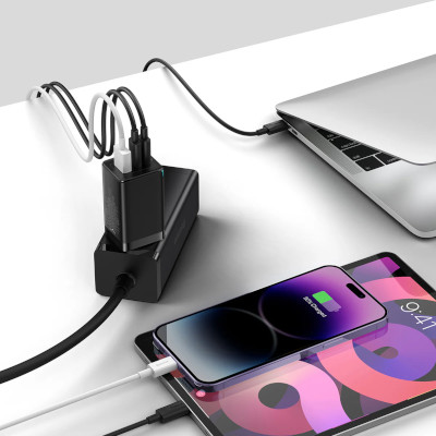 Cadru cu incarcatorul retea cu cablu Baseus GaN5 Pro, 2 x USB-C + USB,  65W, Negru conectat prin cabluri USB Type-C si USB la un laptop, un telefon si o tableta.